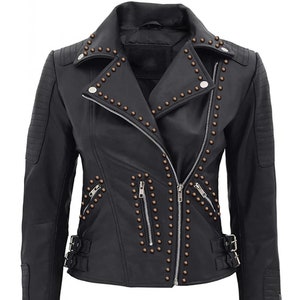 May include: Black leather jacket with a zipper closure and studded details. The jacket has a collar and long sleeves.