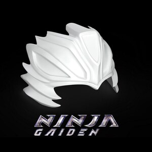 May include: White plastic helmet with a sharp, angular design. The helmet has a raised, pointed crest and a series of ridges and grooves. The text "NINJA GAIDEN" is printed below the helmet.