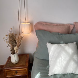 Ivory linen portable lamp. The delicacy of washed linen is found on these portable lamps highlighted with fine retro-style fringes. image 1