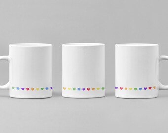 Wrap Around Hearts Mug. Great gift for coffee or tea drinkers. Spread the joy with hearts, pinks, reds, and love.