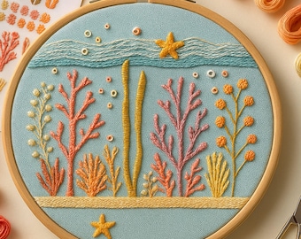 May include: An embroidery hoop featuring an underwater scene with coral, starfish, and bubbles. The design uses various shades of orange, pink, yellow, and blue thread on a light blue fabric. The wooden hoop is visible.