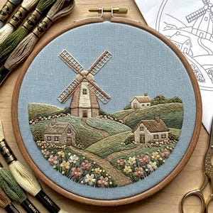 May include: A set of three ceramic mugs with a speckled, matte finish. The mugs are in shades of cream, light gray, and dark gray. Each mug has a simple, minimalist design, perfect for coffee or tea.