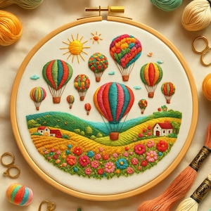 May include: A colorful embroidery hoop featuring a landscape with hot air balloons, flowers, and houses. The balloons are in various colors, including red, orange, green, and yellow. The embroidery is set in a wooden hoop.