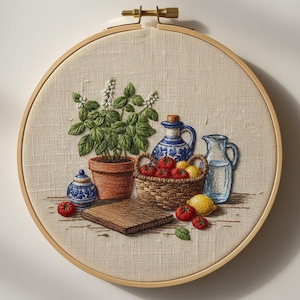 May include: Embroidered still life in a wooden hoop. Features a terracotta pot with a green plant, a blue and white ceramic jar, a basket of red tomatoes and yellow lemons, and a clear glass pitcher. A wooden cutting board and small tomatoes are also included.