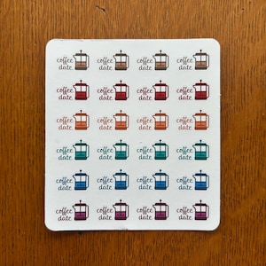 May include: A sheet of 24 stickers featuring a coffee pot with the text "coffee date" in various colors, including orange, red, teal, blue, and purple.