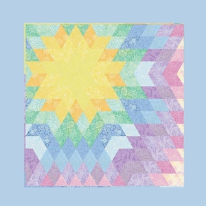 Può includere: Un quilt colorato con un motivo a stella a forma di esplosione in tonalità di giallo, verde, blu, viola e rosa.