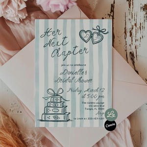 May include: A bridal shower invitation with the text "Her Next Chapter" in elegant script. The invitation features a light blue and white striped background, with illustrations of hearts and books. The invitation is placed inside a pink envelope.