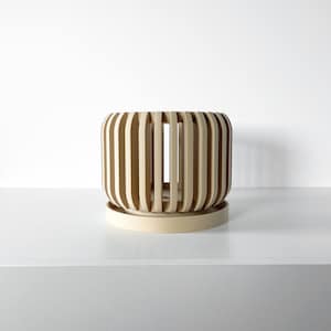 May include: A beige wooden planter with a slatted design and a round base. The planter is empty and ready to be filled with plants.