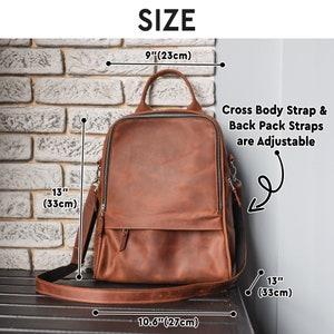 May include: A brown leather backpack with adjustable straps. The backpack measures 9 inches wide, 13 inches tall, and 10.6 inches deep. The straps are adjustable for both a crossbody and backpack style.