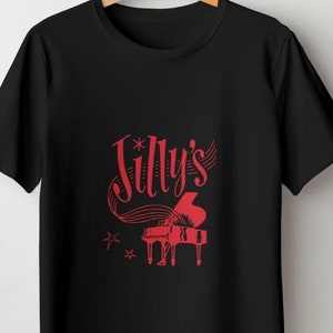 May include: Black t-shirt with a red graphic of a piano and the text "Jilly's" in a stylized font.