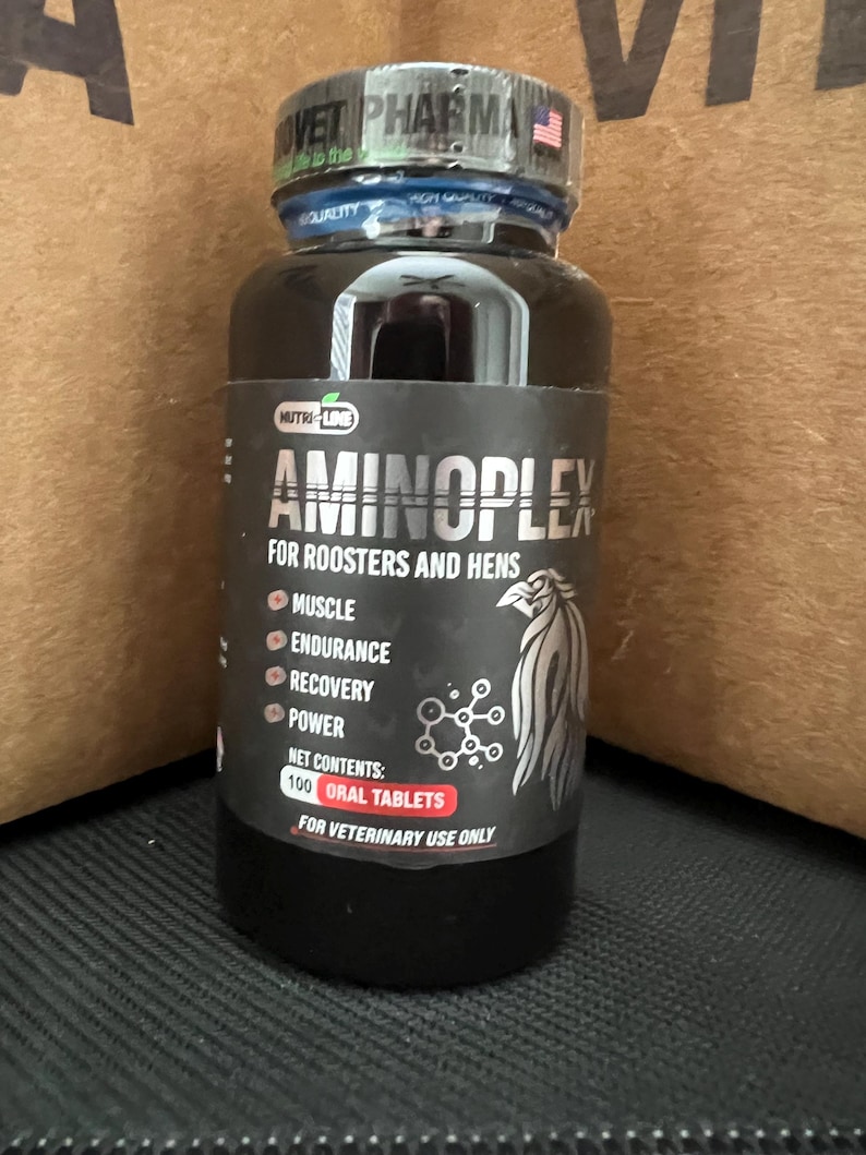 May include: A black bottle with a white label that says "Aminoplex for Roosters and Hens". The label also lists the benefits of the product, which include muscle, endurance, recovery, and power. The bottle contains 100 oral tablets and is for veterinary use only.