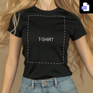 May include: A black t-shirt with a white outline of a rectangle and the word "T-SHIRT" in white text.