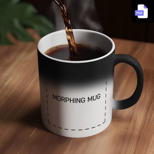 May include: A black and white colour-changing mug with the text "MORPHING MUG" printed on the front. The mug is filled with coffee.