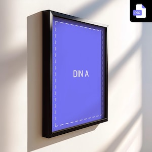 May include: A black picture frame with a white border and the text "DIN A" on a light blue background.