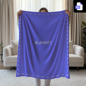 May include: A large, vibrant blue blanket with the word "BLANKET" in white text. The blanket is held up, showcasing its size and texture. A dashed white border frames the edges.