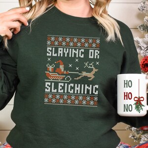 Ugly Christmas Sweater Santa Slaying Sweatshirt Holiday Jumper Festive Winter Pullover Funny Xmas Crewneck Santa Sleighing Shirt