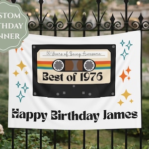 May include: White banner with a black cassette tape design that reads "50 Years of Being Awesome" and "Best of 1976." The banner also says "Happy Birthday James" in black text, with starburst accents.