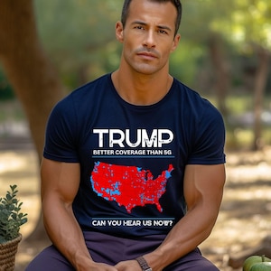 May include: A black t-shirt with a white graphic of a red, white, and blue map of the United States. The text "TRUMP" is above the map, and the text "BETTER COVERAGE THAN 5G" is below the map. The text "CAN YOU HEAR US NOW?" is at the bottom of the graphic.