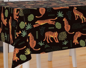 May include: Black tablecloth with a repeating pattern of orange tigers, green leaves, and abstract shapes.