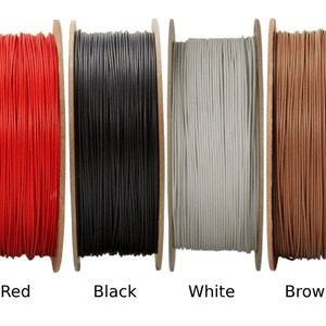 May include: Spools of cord in various colors, including green, blue, red, black, white, brown, purple, and orange.