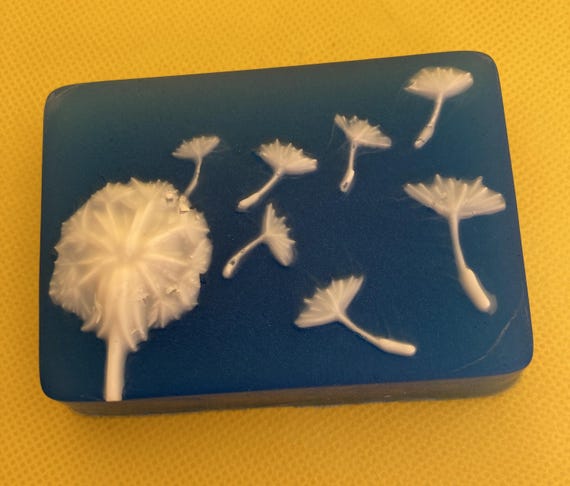 Dandelion Seeds Sailing on a Breeze