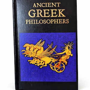 May include: A hardcover book titled "ANCIENT GREEK PHILOSOPHERS" in gold lettering on a black cover. The book features a blue panel with a gold illustration of a chariot pulled by winged horses.