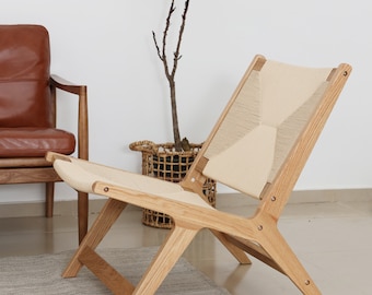 Handwoven paper weave lounge chair | wide and stable seat | oak frame | black lacquered