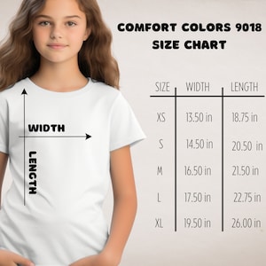 May include: Size chart for Comfort Colors 9018 t-shirts, showing measurements in inches for XS, S, M, L, and XL sizes. The chart shows width and length measurements.