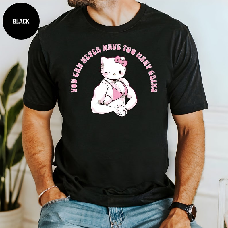 May include: Black t-shirt with a graphic of Hello Kitty in a pink bikini with the text "You can never have too many gains".