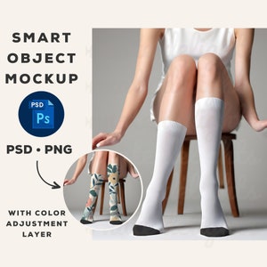 May include: Mockup of a pair of white socks with a black heel and toe. The socks are on a person's legs and the image includes a smaller image of the socks with a floral pattern.