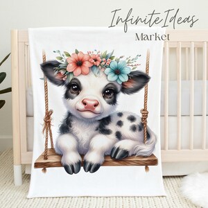 May include: A white and black spotted calf with a pink nose and big brown eyes wears a flower crown with pink, blue, and green flowers. The calf is sitting on a wooden swing with brown ropes.