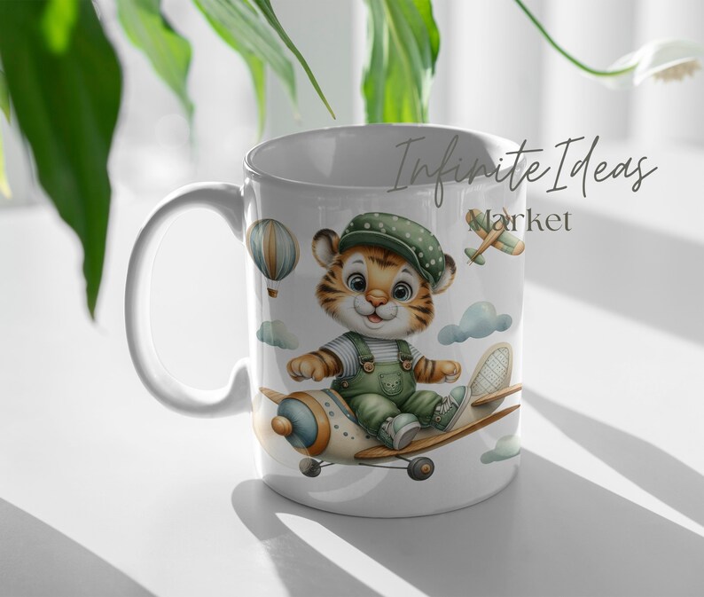 May include: White ceramic mug with a cartoon tiger wearing a green and white outfit and a blue hat, flying a small airplane. The mug has the text "Infinite Ideas Market" on it.