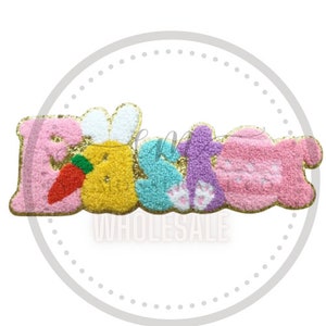 May include: A fluffy, colorful felt Easter word banner with gold glitter accents. The letters are pink, yellow, blue, and purple. The "E" has a white bunny ear and carrot. The "S" has bunny footprints.
