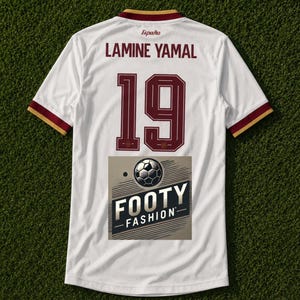 May include: White football shirt with maroon and gold trim. The shirt displays the name "LAMINE YAMAL" and the number "19" in maroon. The word "España" is above the name. A "FOOTY FASHION" logo is at the bottom.