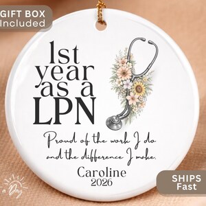 May include: White ceramic ornament with the text "1st year as a LPN" and a stethoscope design with flowers. Includes the text "Proud of the work I do and the difference I make." and the name "Caroline" and the year "2026".