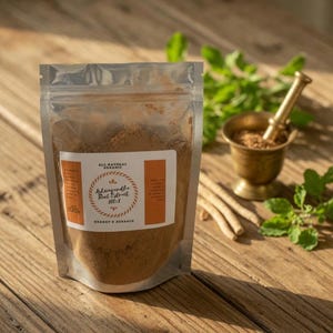 May include: A clear, resealable pouch filled with brown powder, labeled "Ashwagandha Root Extract 100:1" and "Shagott's Herbals." A small brass mortar and pestle, along with fresh green herbs and dried roots, sit on a wooden surface.