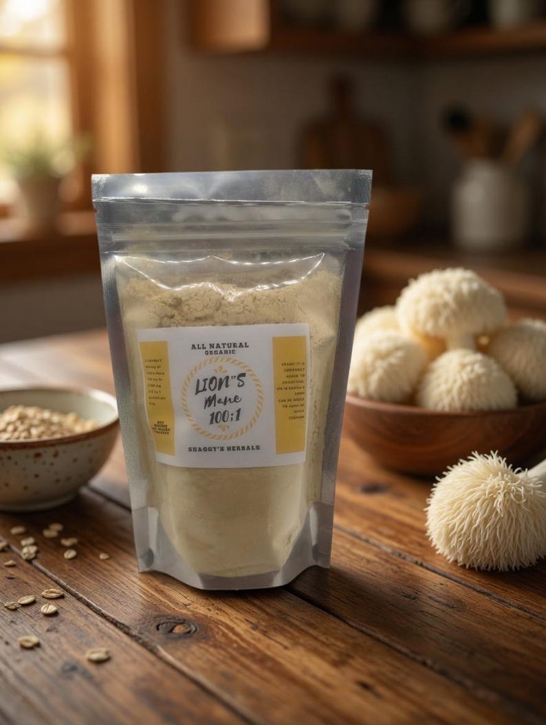 May include: A clear plastic bag of Lion's Mane 100:1 powder sits on a wooden table. The bag has a yellow label with text. A wooden bowl of Lion's Mane mushrooms and a bowl of oats are also on the table. The background is blurred.