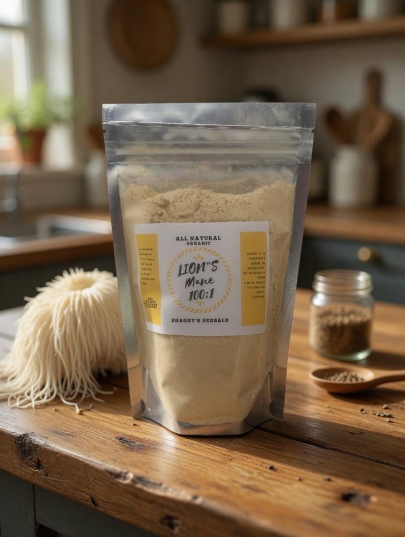 May include: A clear, resealable bag filled with light brown powder labeled "Lion's Mane 100:1" and "Shaggy's Herbals." A small jar and wooden spoon with brown granules are next to the bag. A bundle of light-colored, dried noodles sits to the left.