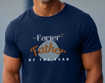 May include: A navy blue t-shirt with the text "Farter" crossed out and "Father of the Year" written in a stylized font.