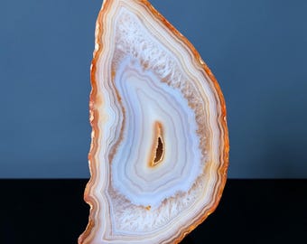 Large Brazilian Floating Blue Center Agate 4.5”. Superior polish and museum specimen