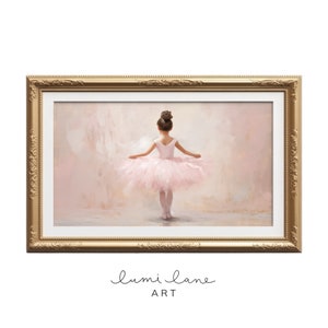 May include: A framed painting of a young ballerina wearing a pink tutu and standing on a stage. The background is a soft pink and the frame is gold.