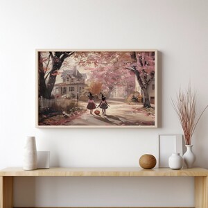 May include: Two children dressed as witches walk down a street lined with trees. The trees have pink and purple leaves. The children are carrying a pumpkin.