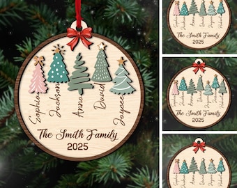 May include: A wooden Christmas ornament with a red ribbon and bow. The ornament features a light wood grain background with a dark wood grain border. It has five stylized Christmas trees in pink, teal, and green. The text reads "The Smith Family 2025".