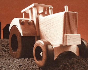 May include: A wooden toy tractor with a brown body and wheels. The tractor has a detailed design with a grill and a cab.