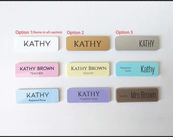 May include: Nine different name tag options with various colors and text. The options include "KATHY" in all caps, "KATHY BROWN TEACHER", "Registered Nurse Kathy", "KATHY Registered Nurse", and "Mrs Brown Teacher".