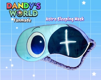 May include: A light blue Astro sleeping mask with a cartoon eye design. The mask has a dark blue section with a white cross and a light blue eye with a white star. The text "Dandy's World Fanmade" is at the top.