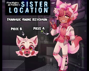 May include: A pink and white anime keychain featuring a character with pink hair, a white shirt, and a pink bow tie. The character is holding a pink and white phone. The keychain is labeled "Sister Location" and "Fanmade Anime Keychain".