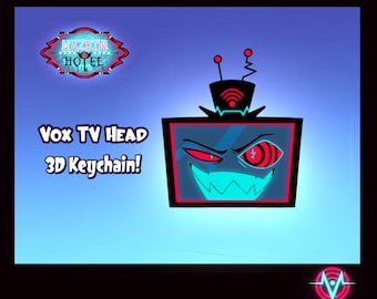 May include: A 3D keychain featuring the Vox TV Head character from Hazbin Hotel. The design includes a black TV screen with a red and teal face, antenna, and the text "Vox TV Head 3D Keychain!" The Hazbin Hotel logo is also visible.