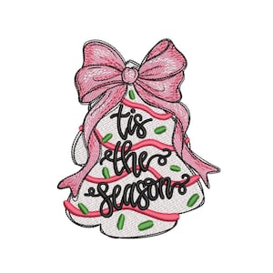 May include: Embroidered Christmas tree design with a pink bow and the phrase "tis the season" in black script. The tree features pink ribbon and green accents, all on a white background.