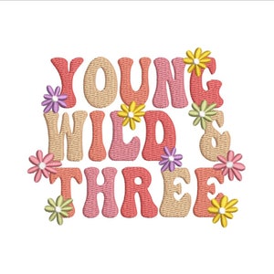 May include: Embroidered design with the text "Young Wild & Three" in a retro font with colorful flowers surrounding the text.